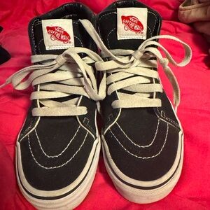Kids high top black and white Vans with laces good condition. Size 2